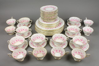 An extensive Coalport Harebell design tea and dinner service comprising 8 dinner plates, 7 side plates, 6 small plates, 8 two handled cups, 8 tea cups and 17 saucers