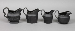 A black basalt cream jug decorated with a band of fruits and leaves 4", do. with classical motifs 4", do. with reeded decoration 4" and 1 other with basket weave decoration 3" 
