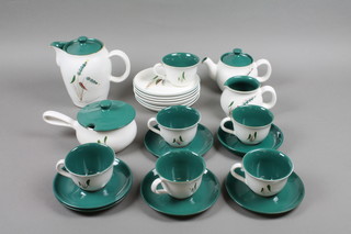 A Denby Green Wheat pattern tea and coffee service comprising teapot, coffee pot, 6 cups, 6 saucers, 6 side plates, jug and lidded pot, teapot and lidded pot f, 