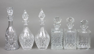 A pair of cut glass spirit decanters and stoppers, 1 other, a pair of club shaped decanters etc 