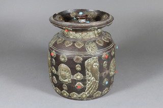 A turned South American barrel with embossed brass and jewelled decoration 