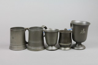 A Victorian pint tankard, raised on a circular spreading foot together with 3 half pint tankards