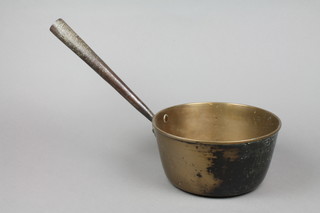 An 18th/19th Century brass saucepan with polished steel handle 9" 