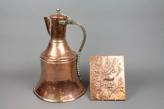 An Arabic bell shaped copper jug and an embossed copper plaque decorated a mouse, monogrammed RH 