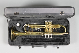 A Stagg brass trumpet, bell marked 77-TCB, contained in a carrying case