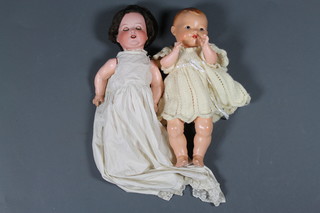 An Armand Marseille doll, with sleep eyes and open mouth with visible teeth and bent limbs, 996 18", replaced hair and  a German baby doll H.W. 16" 