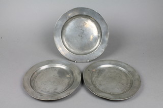 A pewter plate with London touch mark 9" and 2 other pewter plates 9" and 9 1/2"