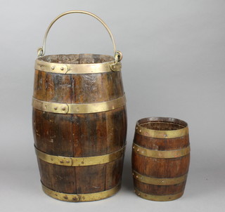 A coopered oak and brass bucket stick stand with swing handle 15" and a small barrel 8 1/2" 