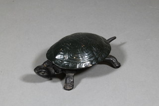 A metal table bell in the form of a tortoise 7"