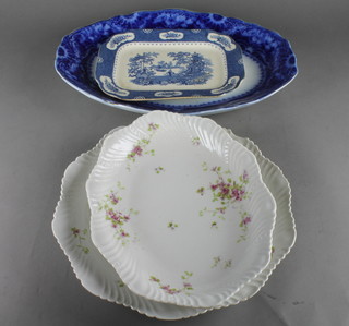 A flo bleu oval patterned relief dish 18 1/2", a blue and white tureen stand 11", a Continental white glazed porcelain plate with floral decoration and an oval shaped dish 14" 