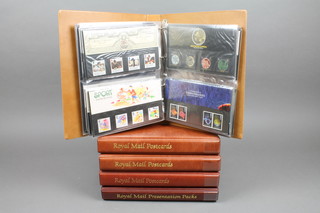 2 albums of Royal Mail presentation stamps together with 4 albums of stamp postcards