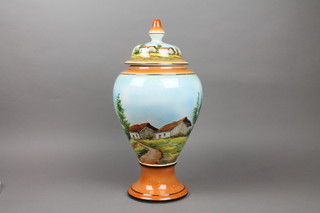 A 20th Century Italian polychrome baluster vase and cover, decorated with landscape views 19"
