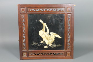 A 19th Century silk embroidered panel of 2 standing geese contained in a pierced hardwood frame 36" x 35" 