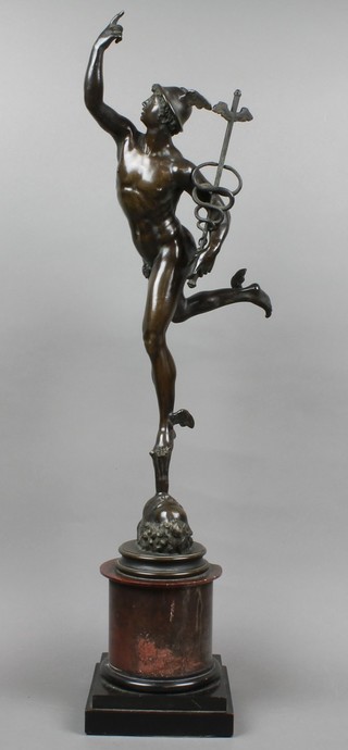 A 19th Century bronze figure of Mercury, raised on a circular mable base 28 1/2"h, slight chip to base