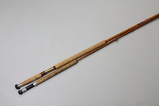A cane 3 section salmon fishing rod 13' with 2 tops, marked J B Long, with spare tip, together with a cane 2 section fishing rod with 1 spare tip 10' 