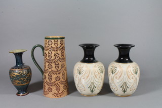 A Doulton Lambeth Slater tapered jug, the brown ground with stylised leaves 10" and 3 other similar items