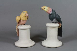2 Continental bisque figures of exotic birds on pedestals 9"