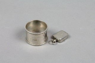 A silver napkin ring and a plated box