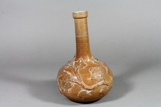 A 19th Century stoneware baluster bottle vase with vinous decoration 9"