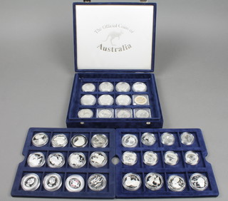 A boxed set of 24 silver commemorative crowns