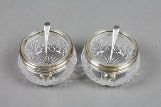 A pair of cut glass and silver mounted salts