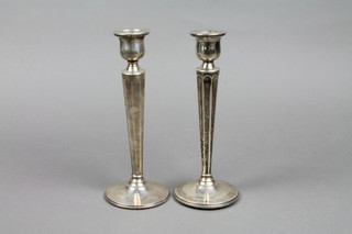 A pair of mid 20th Century silver tapered candlesticks 9"