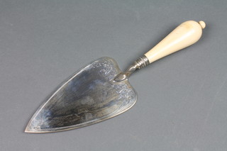 A Victorian silver presentation trowel with scroll decoration and turned ivory handle, London 1864 12" 