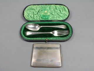 A Victorian cased silver christening spoon and fork Sheffield 1892 and an engine turned silver cigarette case, 6 ozs 
