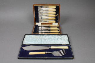 A pair of silver plated fish servers by Walker & Hall together with a plated cased set.