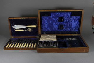 A set of 6 silver plated tea spoons, cased, a canteen of 6 silver plated fish knives and forks complete with servers and an oak canteen box