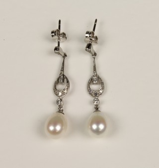 A pair of 18ct white gold open diamond and pearl drop earrings