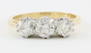 An 18ct yellow gold 3 stone diamond claw set ring, approx 1.55ct