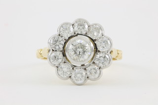 An 18ct yellow gold diamond cluster ring, the centre brilliant surrounded by 10 smaller cut brilliant stones, approx 1.70ct