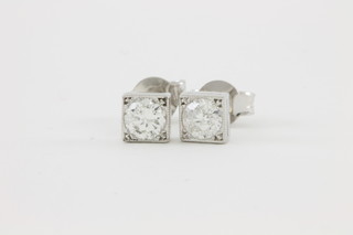 A pair of 18ct white gold brilliant cut single stone diamond ear studs, approx 0.65ct