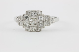 An 18ct white gold diamond step mount Art Deco style ring
