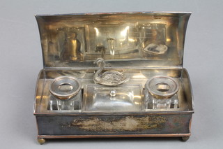 An Edwardian dome shaped silver plated ink stand, stamp box,  2 cut glass inkwells and a base metal menu holder in the form of  a swan