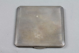A silver cigarette case with engine turned decoration, Birmingham 1940, 3ozs
