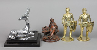 A chromium plated figure of an Eastern style deer 7" raised on a black stepped marble base, 2 brass figures of standing knights 7" and a resin figure of a seated gentleman 5" 