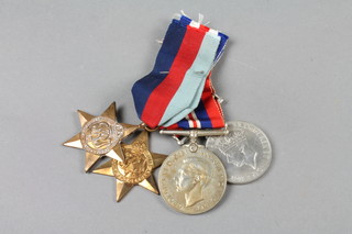 A group of 4 medals comprising 1939-45 Star, France and Germany Star, Defence and War medal together with a group of miniatures