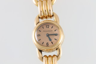 A lady's 18ct rose gold Jaeger LeCoultre wristwatch with back winder and open bracelet, gross weight 34 grams