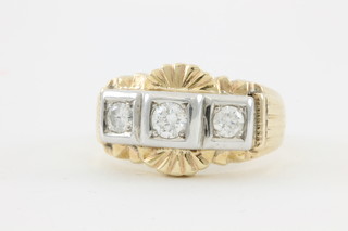 A gentleman's 18ct yellow and white gold 3 stone stepped mount diamond ring