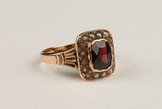 A 19th Century garnet and seed pearl gold ring