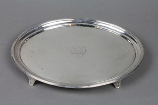 A Georgian oval silver card tray with armorial, on scroll legs, London 1803, approx. 15 ozs 10"