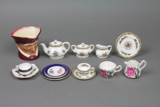 A collection of miniature china including a Royal Doulton mug