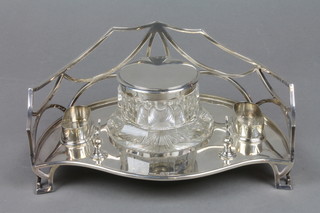 A Victorian silver ink stand, the pierced gallery enclosing a cut glass silver mounted inkwell, 2 receptacals with pen stand, on raised bracket feet 9" 