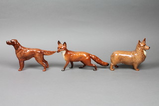 A Beswick figure of a standing fox 9.5" a ditto Corgi 7" and a Retriever 9" 