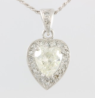 An 18ct white gold heart shaped diamond pendant,  surrounded by brilliant diamonds, hung on an 18ct gold chain, approx 2ct