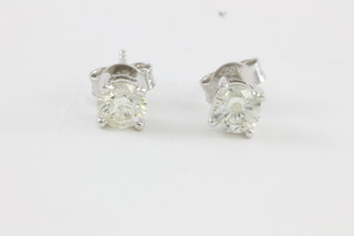 A pair of 18ct white gold single stone diamond ear studs, approx 1.03ct