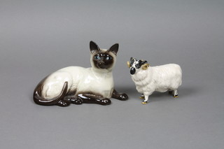 A Beswick figure of a reclining Siamese cat 1559 7" and a ditto ram 5"
