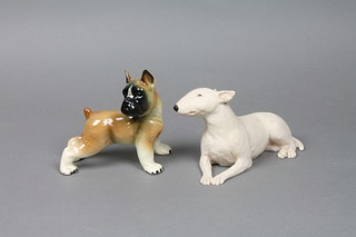 A figure of a bulldog 5" and a resin figure of a dog 